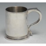 A George I silver spreading cylindrical half pint mug, scroll-capped handle, skirted base, 9cm high,