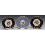 A pair of Coalport shaped circualr plates, painted by F. Howard, signed with flowers, cobalt blue