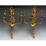 A pair of large Neo-Classical Revival ormolu three branch wall sconces, ribbon crestings,