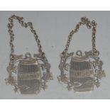 A pair of Elizabeth II silver wine labels, Brandy and Whisky. each as a barrel, 5cm wide,