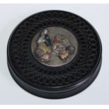 A 19th century lignum vitae circular snuff box, engine turned and applied with a Japanese moxed