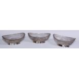 A set of three George III Old Sheffield Plate boat shaped cake or sweetmeat baskets, gadrooned