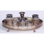 A George III Old Sheffield plate oval standish, the glass inkwells centred by a circular wafer box