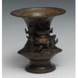 A Chinese bronze vase, cast with figures beside a censer crested by blossoming prunus, 15cm high,