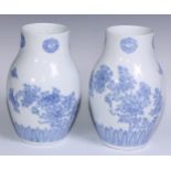 A pair of Japanese ovoid vases delicately painted in tones of pale blue with chrysanthemums,