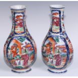 A pair of Chinese flatenned ovoid vases, painted in polychrome with Mandarins and attendants, in a