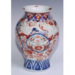 A Japanese ovoid vase, moulded with dragons and painted in the Imari palette, 30cm high, Meiji