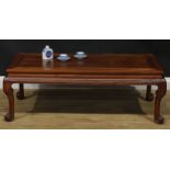 A Chinese hongmu waisted low tea or kang table, rectangular top, cabriole legs, scroll feet, 43cm