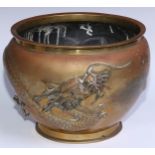 A Chinese bronze ovoid jardiniere, in relief with a ferocious dragon, 28cm diam, early 20th century