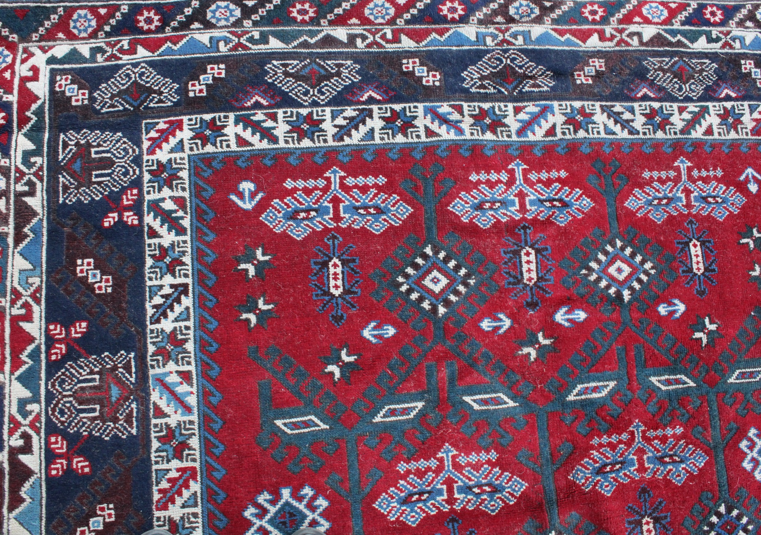 A Middle Eastern rectangular wool rug or carpet, the field worked with hooked medallions and - Image 5 of 5