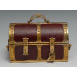 An early 20th century brass mounted red morocco leather sewing casket, as a domed trunk, the