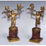 A pair of 19th century gilt bronze and rosso antico marble two-light figural mantel candelabra, each