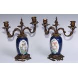 A pair of Chinese porcelain ovoid vases, European ormolu mounted as candelabra, painted in the