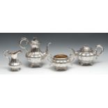 A composed Victorian silver four piece melon shaped tea and coffee service, engraved with flowers