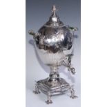 A George III Rococo Old Sheffield Plate ovoid pedestal tea urn or samovar, domed cover with