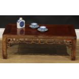 A Chinese hardwood low kang or tea table, rectangular top, shaped and pierced apron carved with