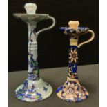 A Bursley Ware Pagoda pattern candlesticks, 37cm high, printed marks; another, Astea, 32cm high,