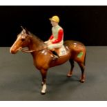 A Beswick Racehorse and Jockey, standing, brown gloss jockey in light green and light blue silks