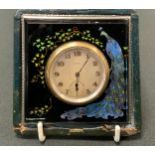 An early 20th century 8 day travel clock, the square case with peacock, silver mount, morocco