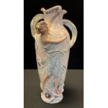 A Royal Dux Art Nouveau two handle vase, in relief with a musician holding a triangle, the verso