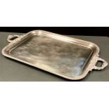 A large two handled rounded rectangular gallery tray, gadrooned border, leafy scroll handles, 78cm