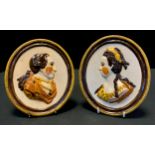 A pair of 19th century oval pearlware portrait plaques, modelled in high relief with profile