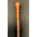 A Japanese bamboo walking cane, carved in relief with samurai, 88cm long, Meiji period
