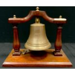 A bronze ship's bell marked "From HMS Tiger Jutland 1916", 18cm high, 18cm diameter, suspended