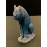 A siliceous pottery turquoise model, of a seated lion, in the Iranian Seljuk style, 14.5cm high