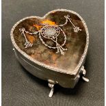 An Edwardian silver and tortoiseshell heart shaped jewellery box, inlaid with silver ribbon tied