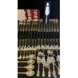 A Fiddle and Shell pattern canteen, of eight, comprising table spoons, soup spoons, dinner knives,