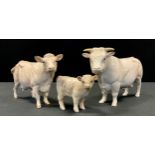 A Beswick Charolais bull, cow and calf, designed by Alan Maslankowski, gloss, model No. 2463A,