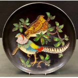 A Karlsruhe, Staatliche Majolika-Manufaktur circular charger, tube lined with golden pheasants on
