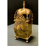 A 17th century style brass lantern clock, retailed by Finnigan's, Manchester, 30cm high