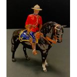 A Beswick model, Canadian Mountie Policeman on black horse, gloss, model No 1375, 20.5cm high