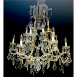 A large Venetian style six branch tubular glass chandelier, suspended with faceted swaps and