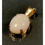 A large oval white opal cabochon pendant, approx 16.35mm x 12.42mm x 5.79mm, 9ct gold mount,