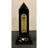 A 19th century Derbyshire Ashford marble obelisk thermometer, inlaid with a lily, ivorine scale,