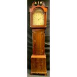 A George III oak longcase clock, swan neck pediment, turned and reeded columns, brass capitals,