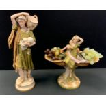 A Royal Dux figural centrepiece, of two maidens, standing with oversize shells, 35cm high, pink