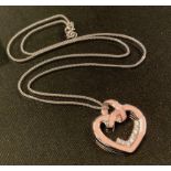 An enamelled 18ct white gold diamond heart pendant necklace, pink enamelled heart set with eight