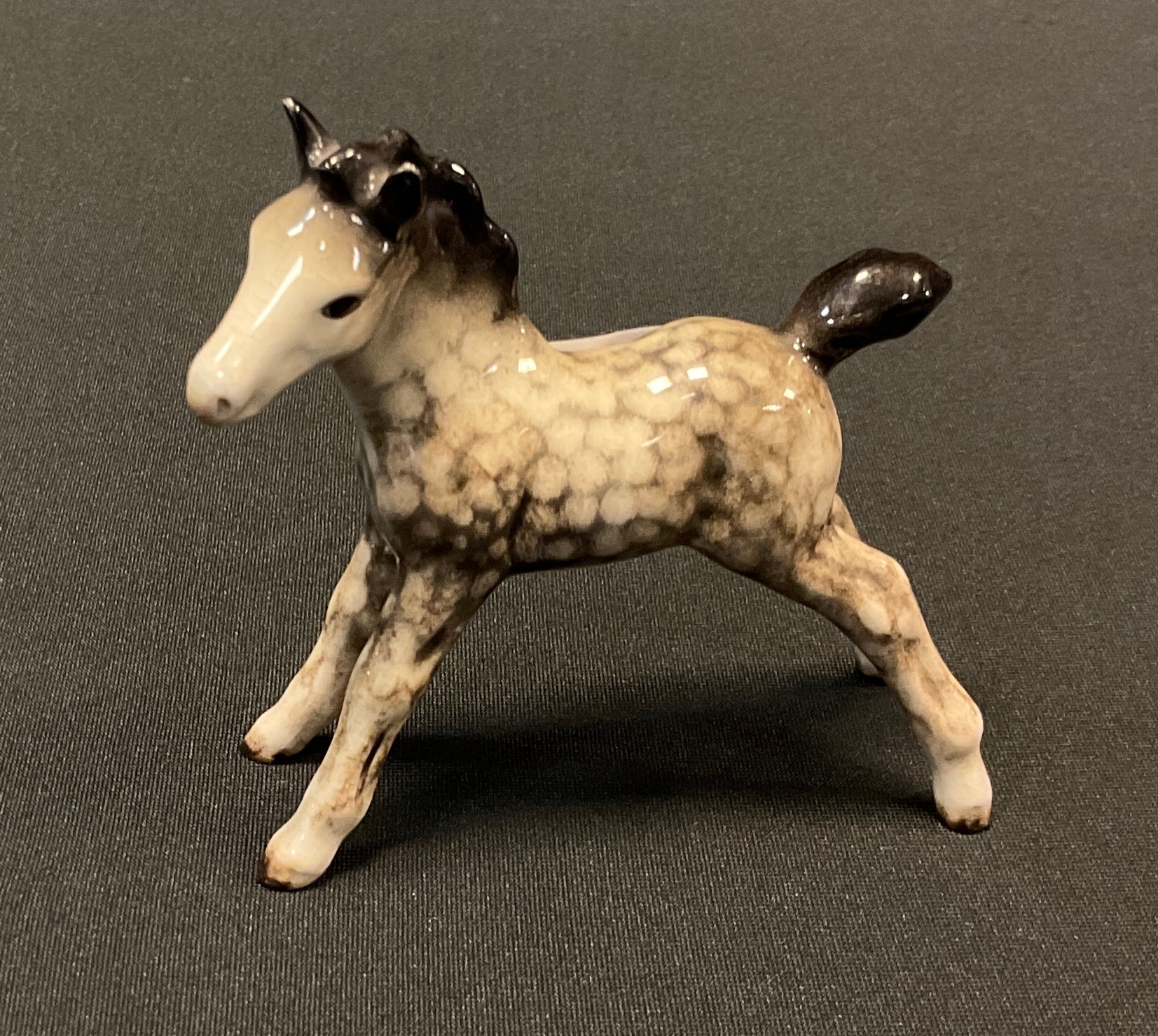 A Beswick model, standing foal, rocking horse grey, printed marks, model 763