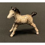 A Beswick model, standing foal, rocking horse grey, printed marks, model 763