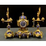 A French gilt metal and enamelled clock garniture, in Louis XVI style, the 8.5cm circular dial