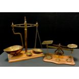 A pair of 19th century brass and mahogany balance scales, rectangular base, 37cm high, c.1880; a set