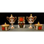 A pair of Abbeydale Chrysanthemum pattern two handled pedestal trophy cups and covers, 16.5cm