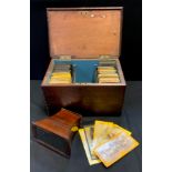 A 19th century rosewood stereoscopic viewer, fitted case; a quantity of early stereoscopic slides,