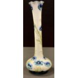 A Moorcroft McIntyre Blue Poppy vase, long neck and bulbous body, tube lined with flowerheads and