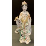 A Japanese pottery figure, of a deity, standing wearing flowing robes, 32cm high, Meiji period