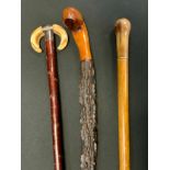 A Victorian silver mounted walking stick, double boar's tooth handle, 83cm long, London 1893; others